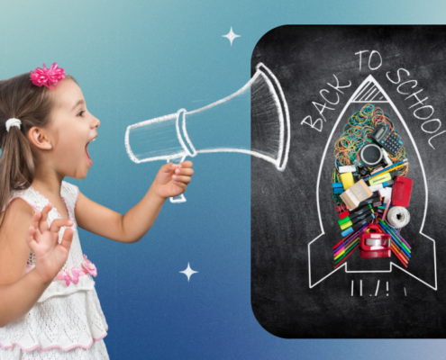Confident child with a megaphone and back to school rocket drawing on a blackboard at School Beyond Limitations
