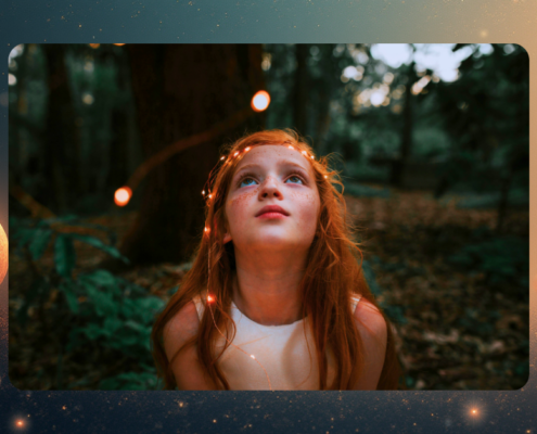Child smiling in awe while looking at glowing lights in the forest