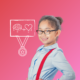 A young girl with glasses smiling when learning strategies for Positive School Experiences